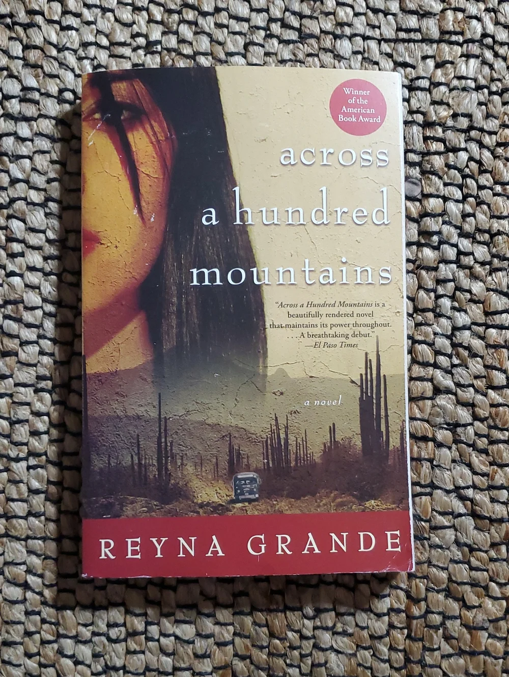 Across a Hundred Mountains by — Red and Tan Paperback